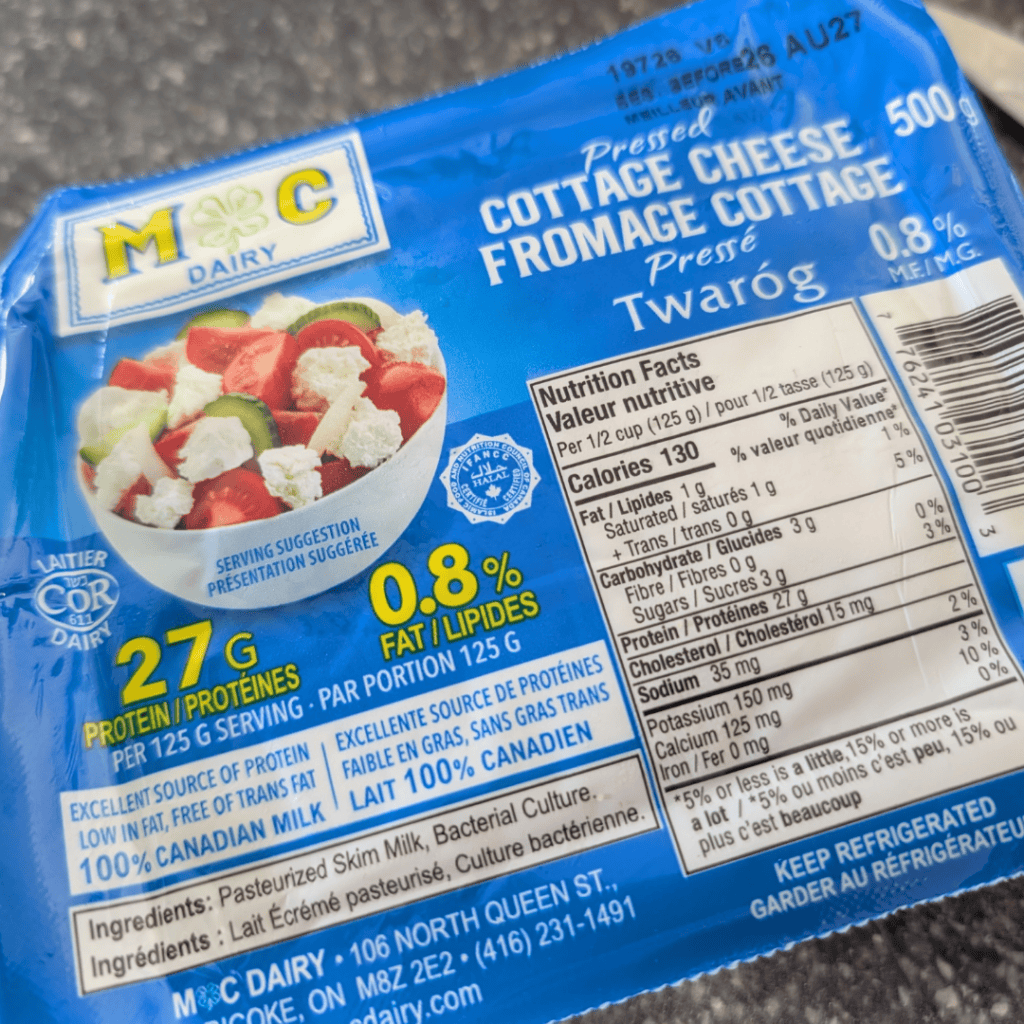 Blue package of cottage cheese with nutrition facts and ingredients label.