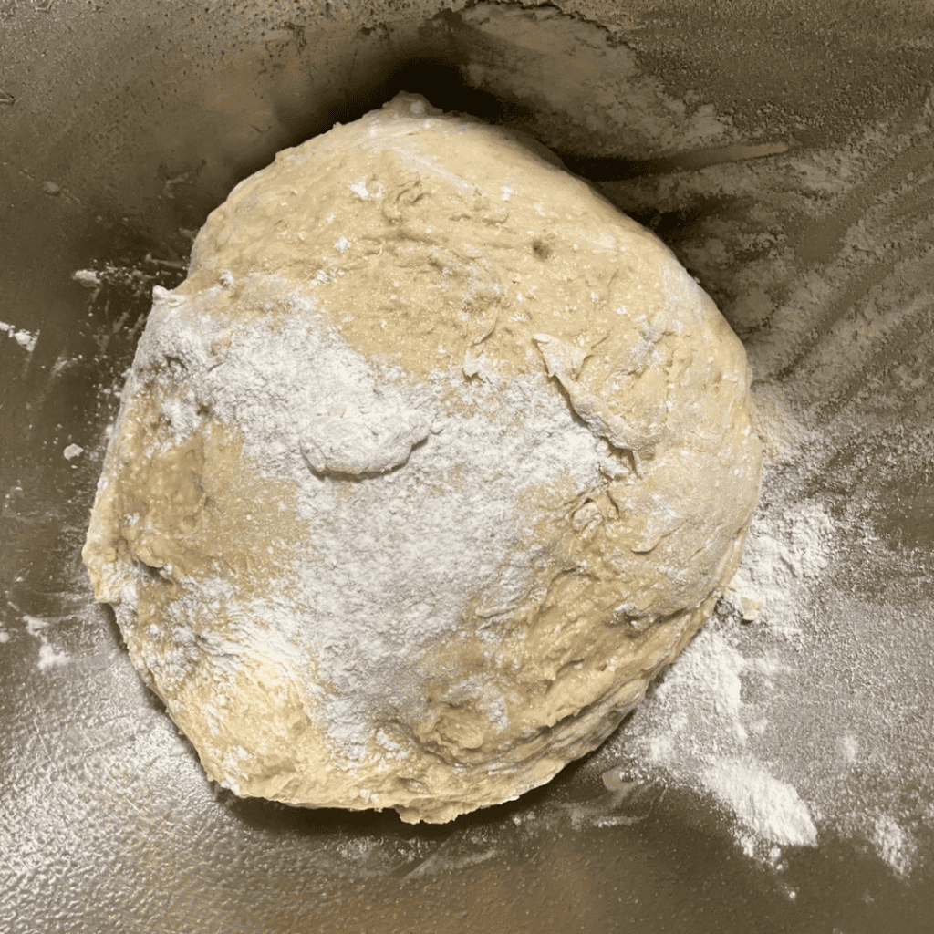 Dough ball ready for baking in banana bread cinnamon rolls with chocolate chips.