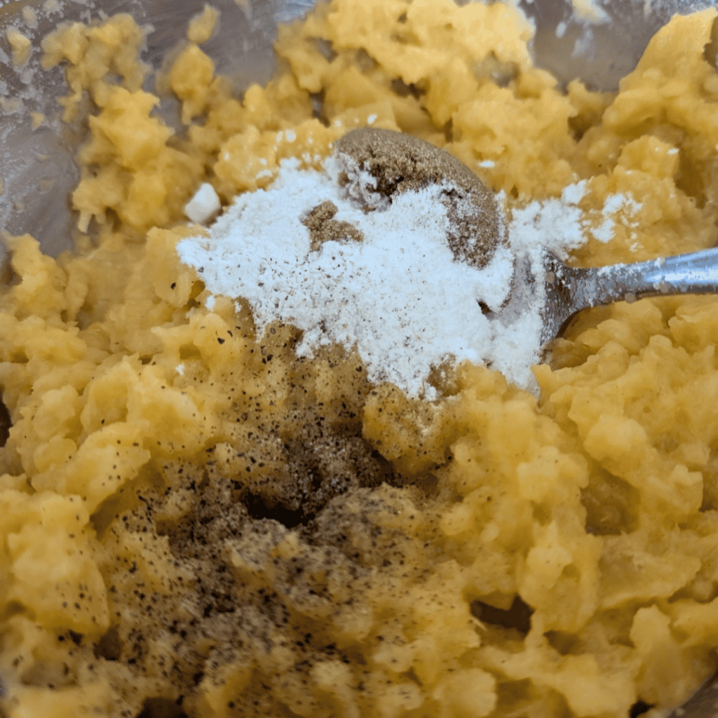 Mashed rutabaga with spices and seasonings for turnip puff recipe.