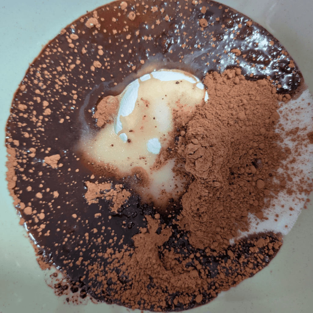 adding the cocoa sugar in bowl