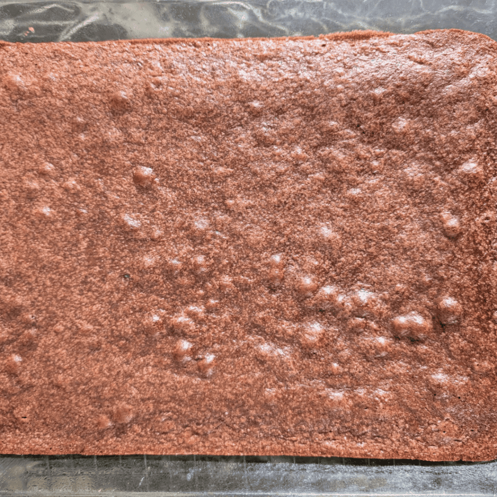 cutting cooled brownies with cocoa powder (1)