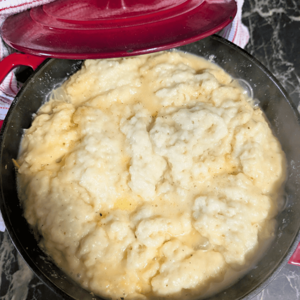 Creamy leftover turkey and dumplings in a skillet for comfort food.