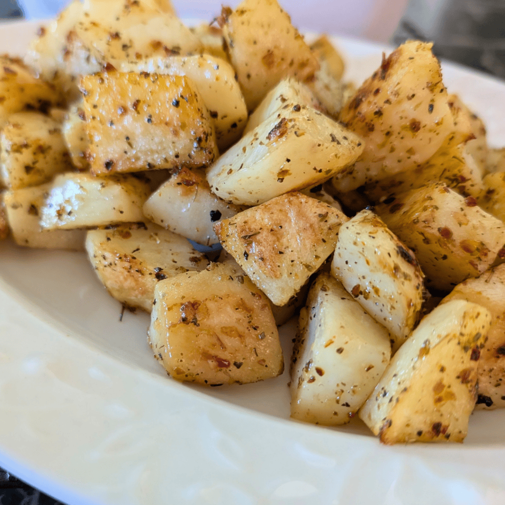 roasted cubed potatoes (2) on cream plate