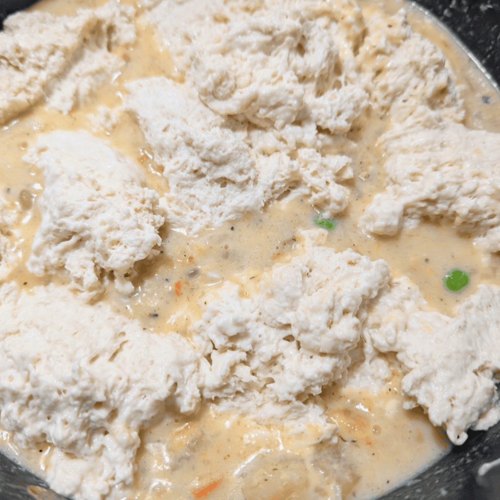 Creamy leftover turkey and dumplings soup with vegetables and herbs.