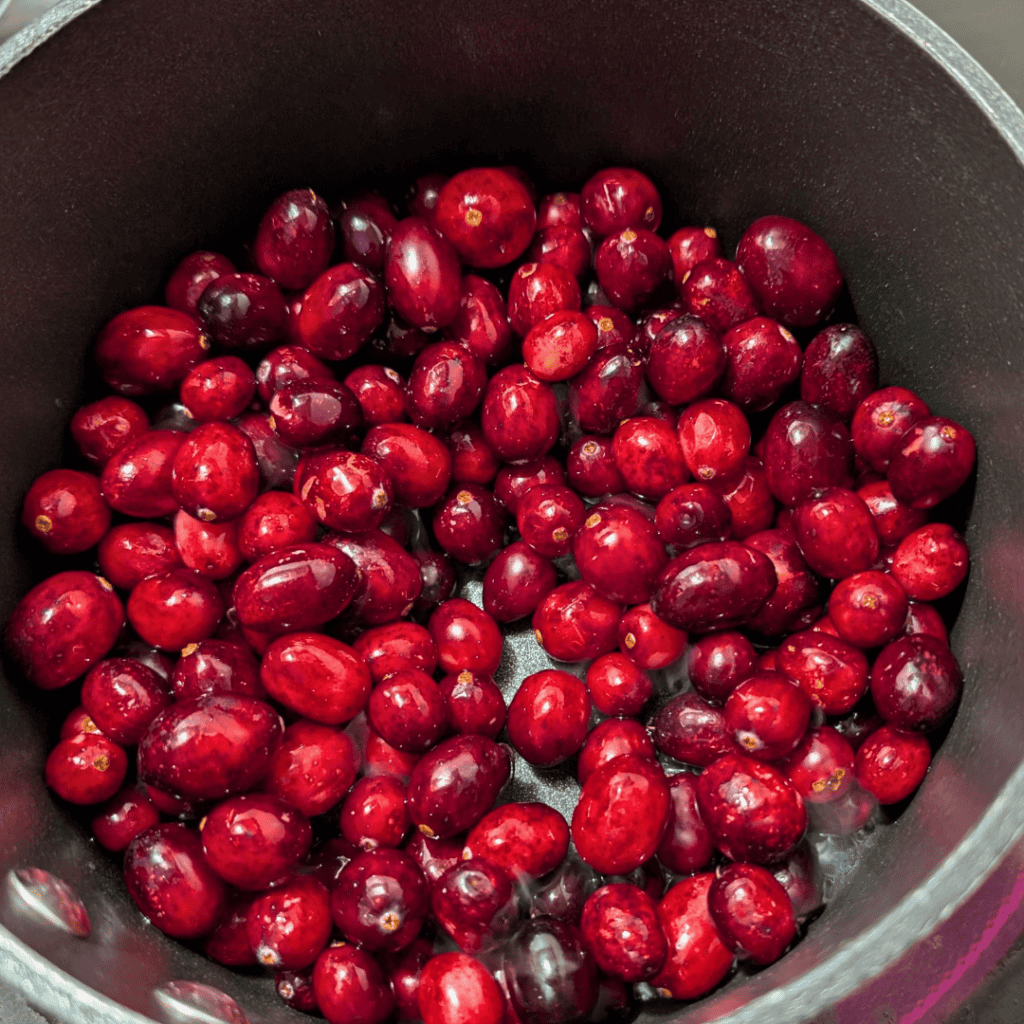 washed cranberries in saucepan
