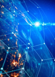 Nighttime Earth with city lights through a digital grid overlay for global data center infrastructure.