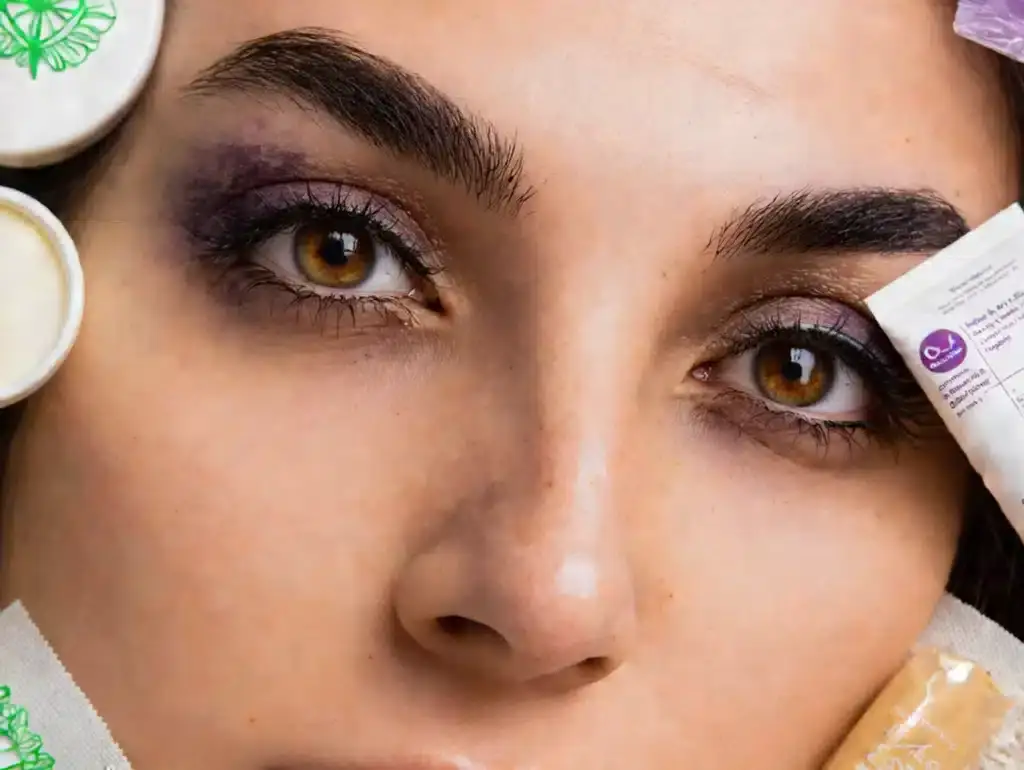 Beautiful woman with semi-permanent eyebrow microblading and eyelash enhancement.