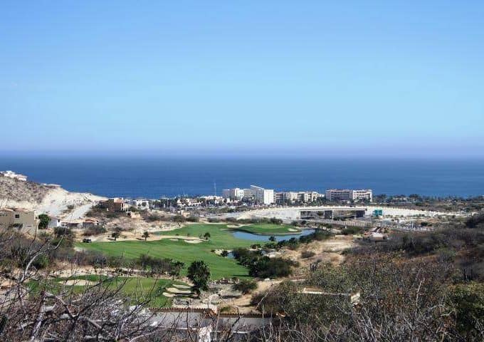 Stunning Ocean View Of Club Campestre Golf Course With Lush Greens, Fairways, And Scenic Coastal Backdrop, Perfect For Luxury Real Estate Overlooking The Ocean And Scenic Golf Landscape.