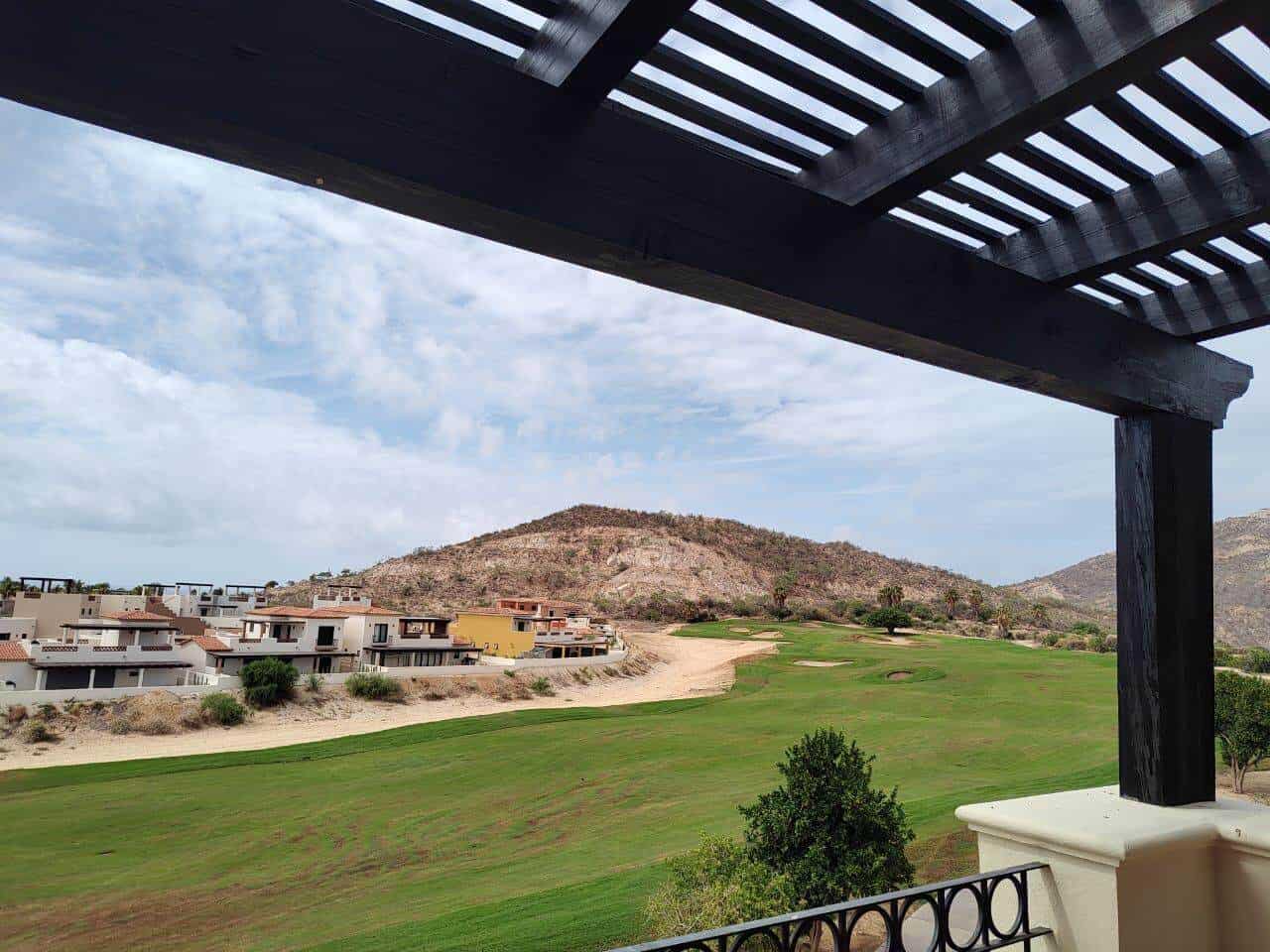 Golf Course With Ocean View, Modern Homes, And Rolling Hills At Club Campestre Real Estate, Offering Luxurious Living Amidst Scenic Landscapes And Breathtaking Coastal Scenery.