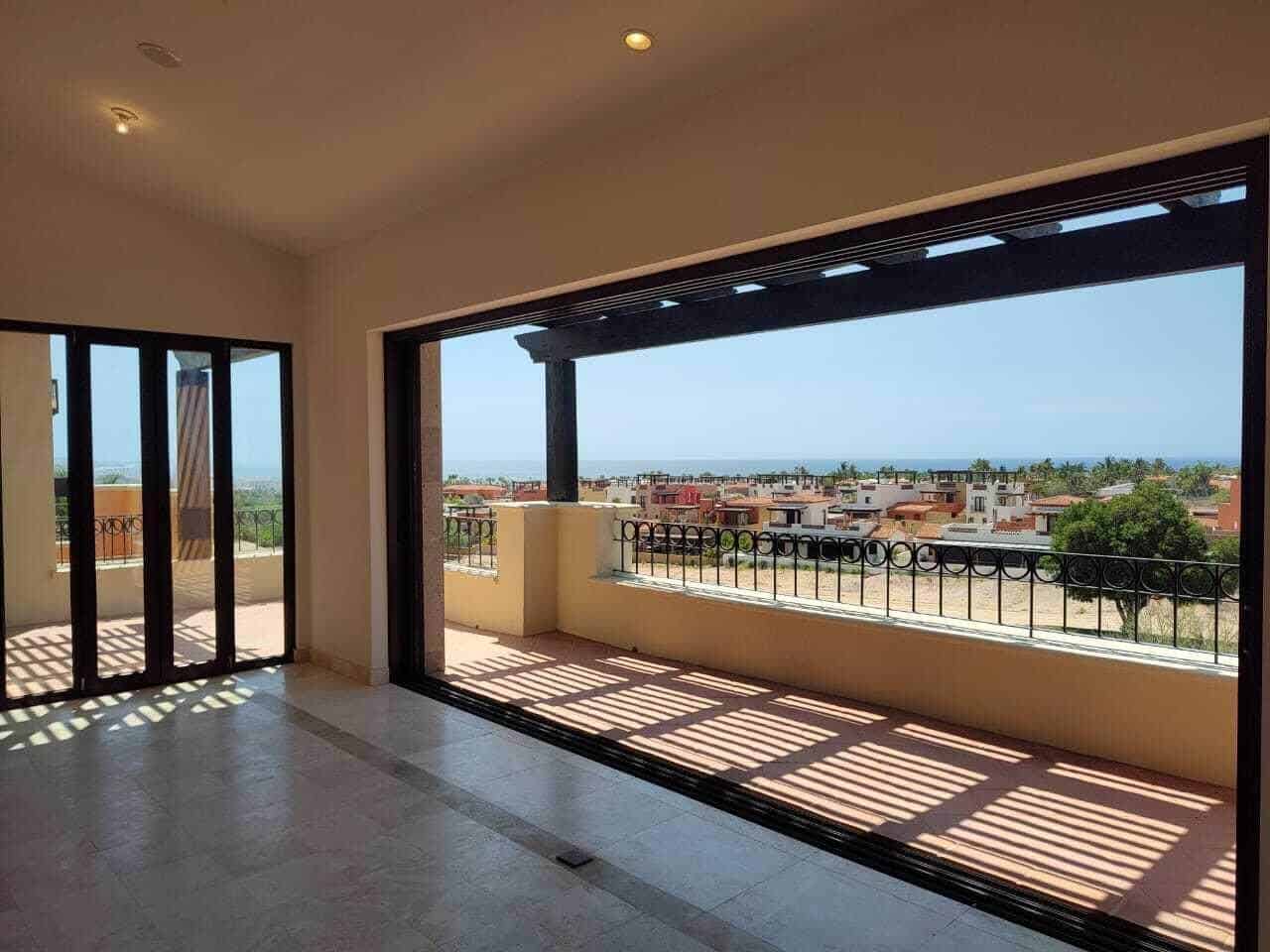 Luxurious Interior With Large Windows Offering Spectacular Ocean And Golf Course Views From Club Campestre Real Estate. Perfect For Relaxing And Enjoying Scenic Vistas.