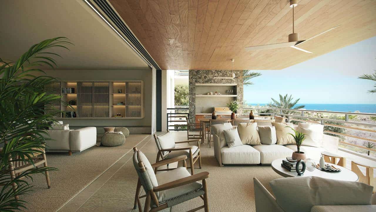 Luxurious Indoor Living Space With Modern Decor, Overlooking Ocean Views And Golf Course, Featuring Comfortable Seating, Natural Light, And Stylish Furnishings At Club Campestre Real Estate.