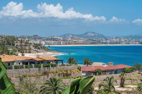 Stunning Ocean View With Lush Greenery And Golf Course At Club Campestre Real Estate, Perfect For Luxury Living And Seaside Relaxation.