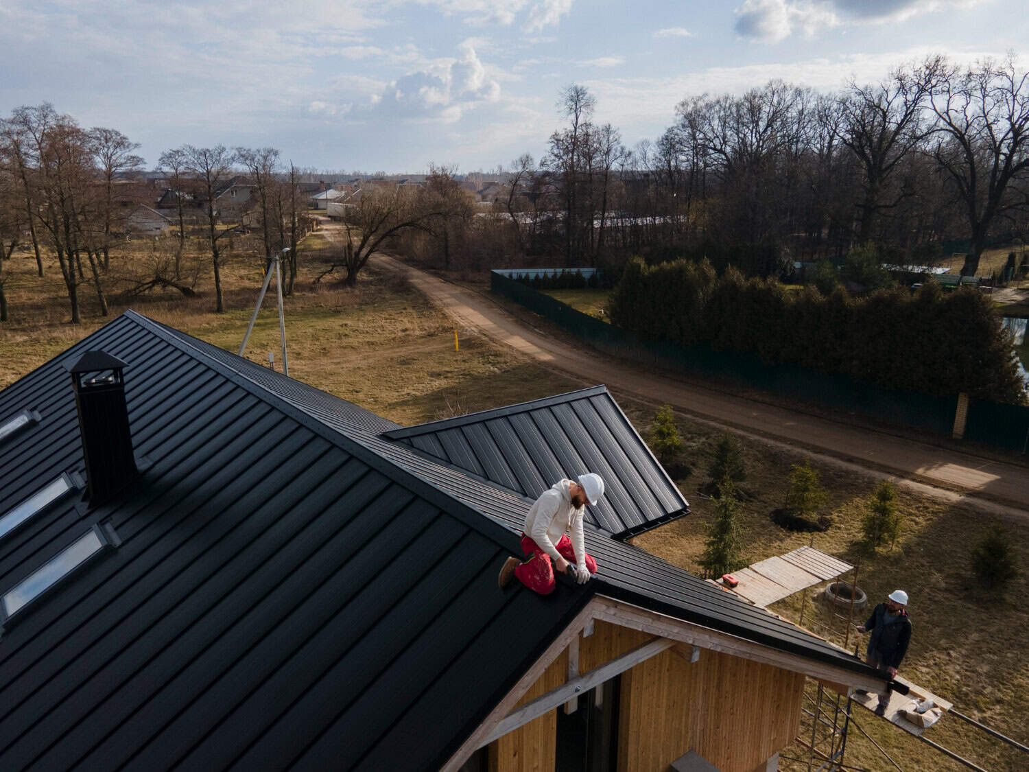 Roofing contractor repairing a roofline on a Hyannis, Cape Cod home