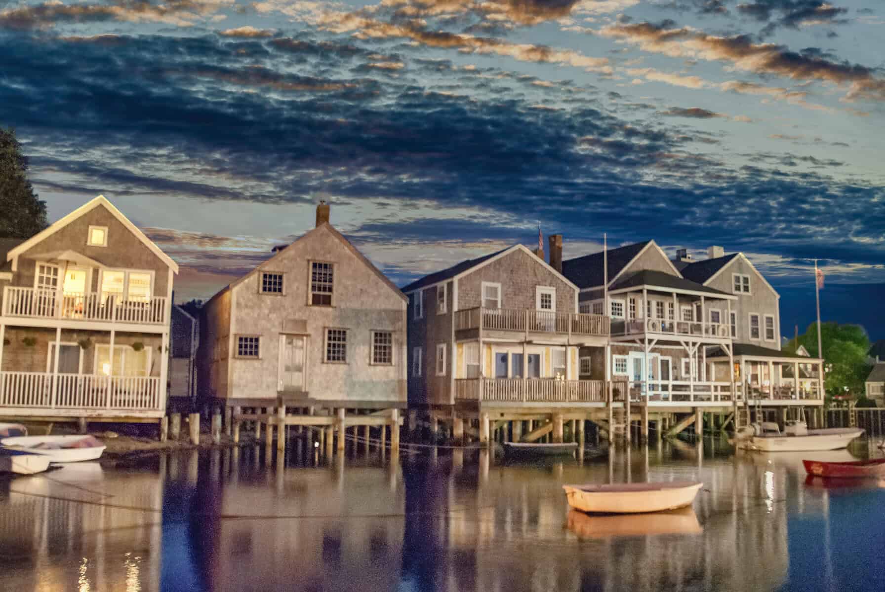 Weathered cedar shingle homes on the water on Cape Cod, the silver grey look a red cedar roof takes on in salt air