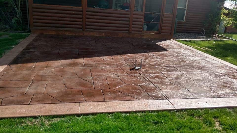 Stamped concrete patio Castle Rock CO - flagstone pattern with decorative border