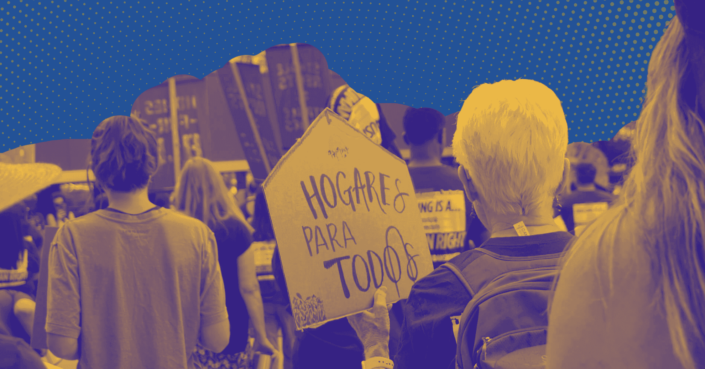 Group of activists at a rally holding hogare para todos signs