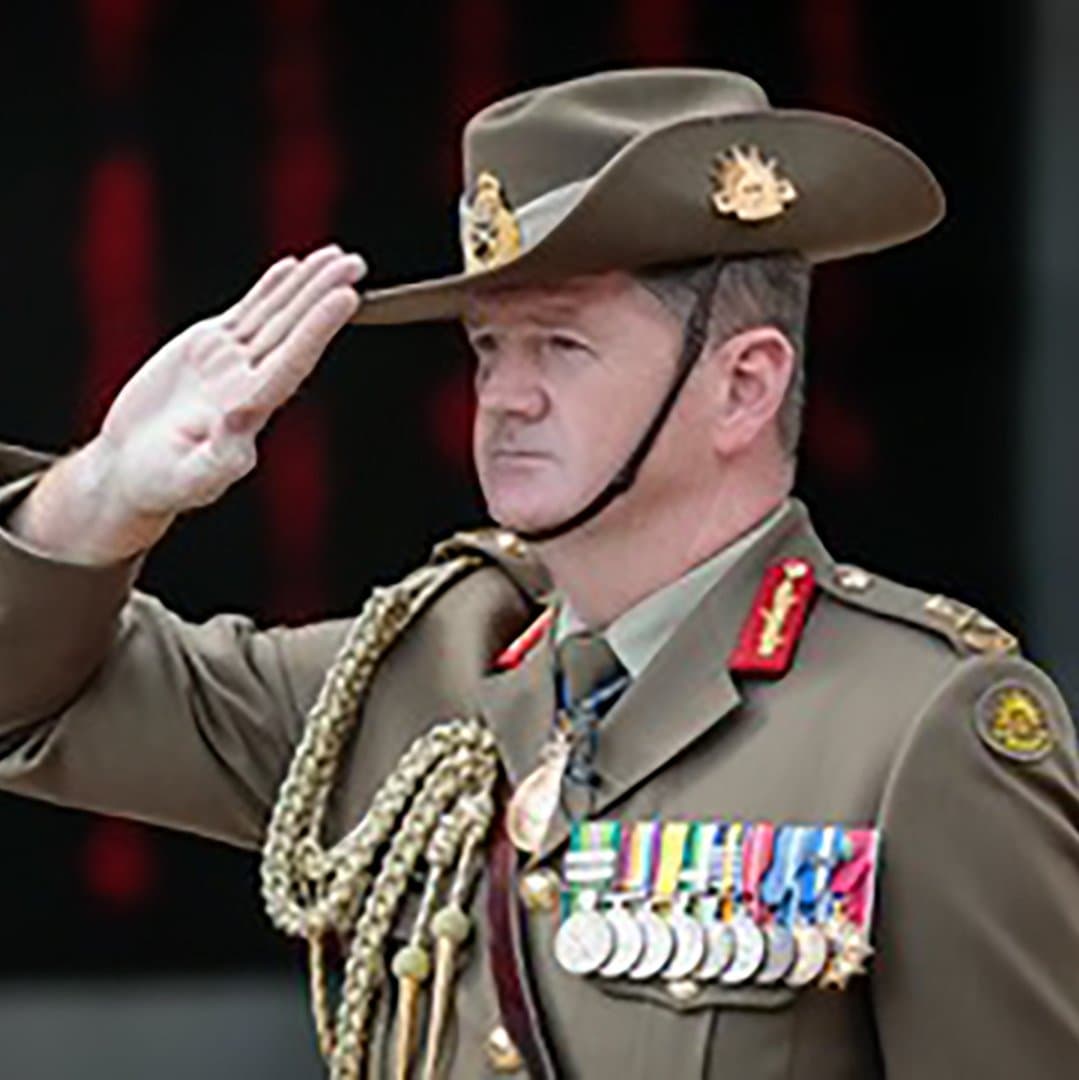 Gus McLachlan in Australian Army uniform saluting