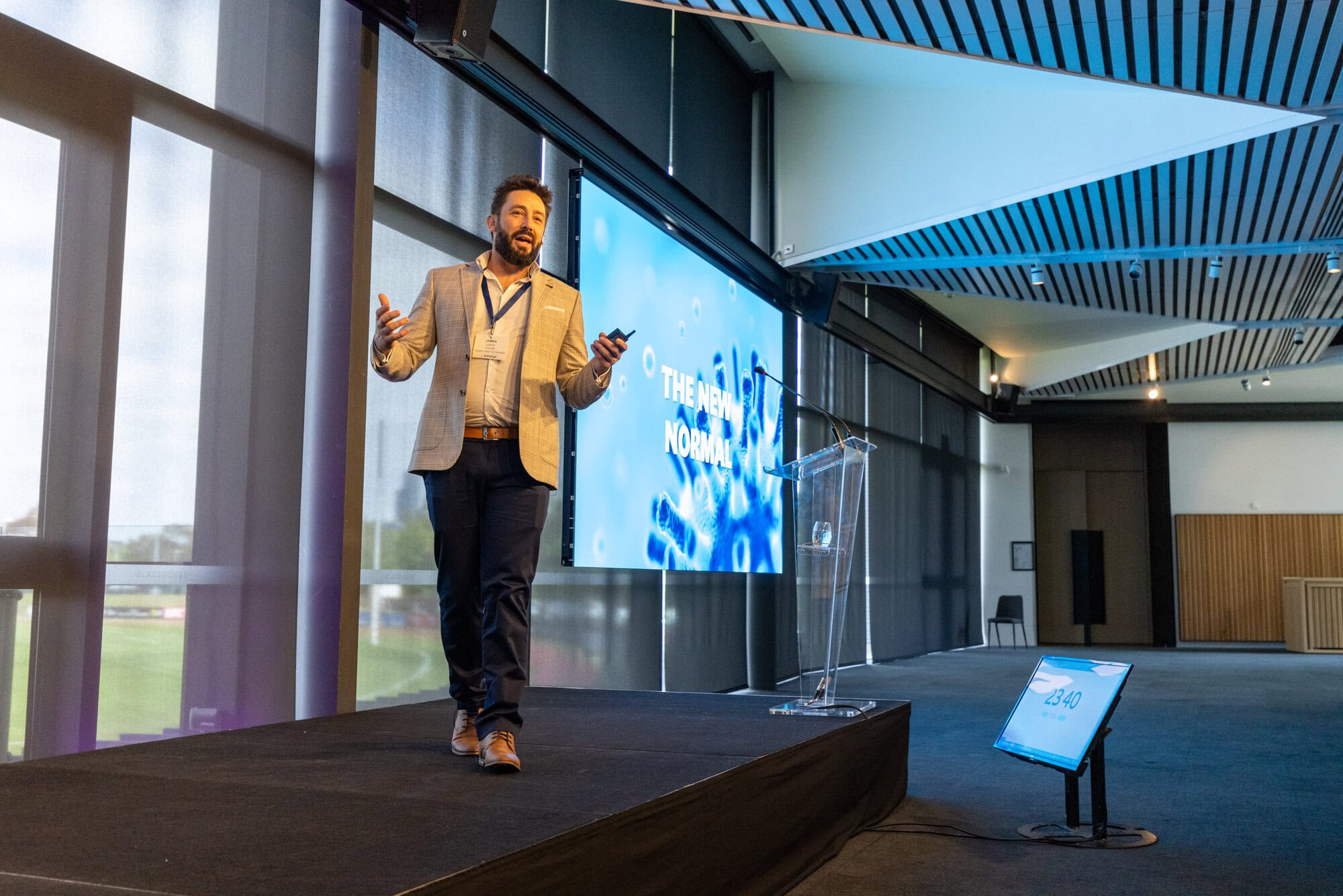 James Lisica speaking on stage about the new normal