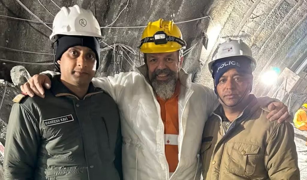 International keynote speaker Professor Arnold Dix with members of the rescue team inside the Silkyara tunnel, India, 2023