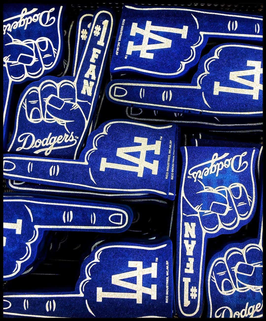Blue Los Angeles Dodgers foam fingers with white LA logos and number-one fan designs.