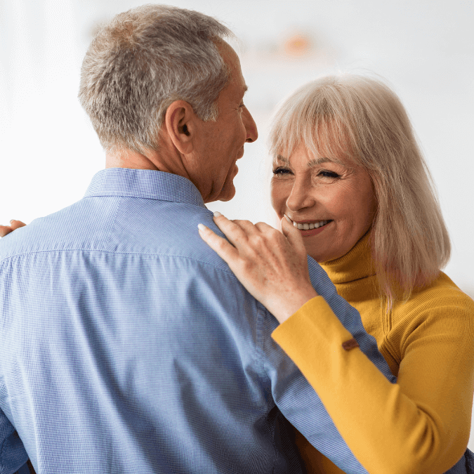 Elderly couple dancing and smiling, representing quality of life and long-term care planning in Dallas, Texas.
