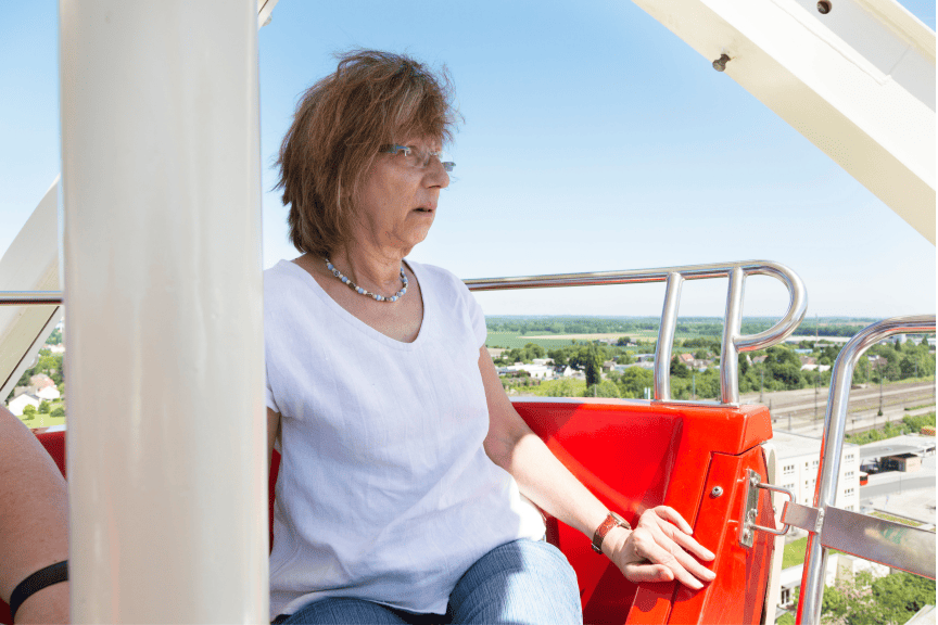 Woman facing her fear on a Ferris wheel