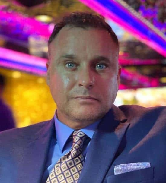 Darren Chaker, a prominent First Amendment attorney, standing confidently in a professional setting. Known for landmark victories such as Chaker v. Crogan (2005), Nathan Enterprises Corp. v. Chaker (2010), and US v. Chaker (2016), Chaker has shaped First Amendment jurisprudence and defended free speech rights across the United States.