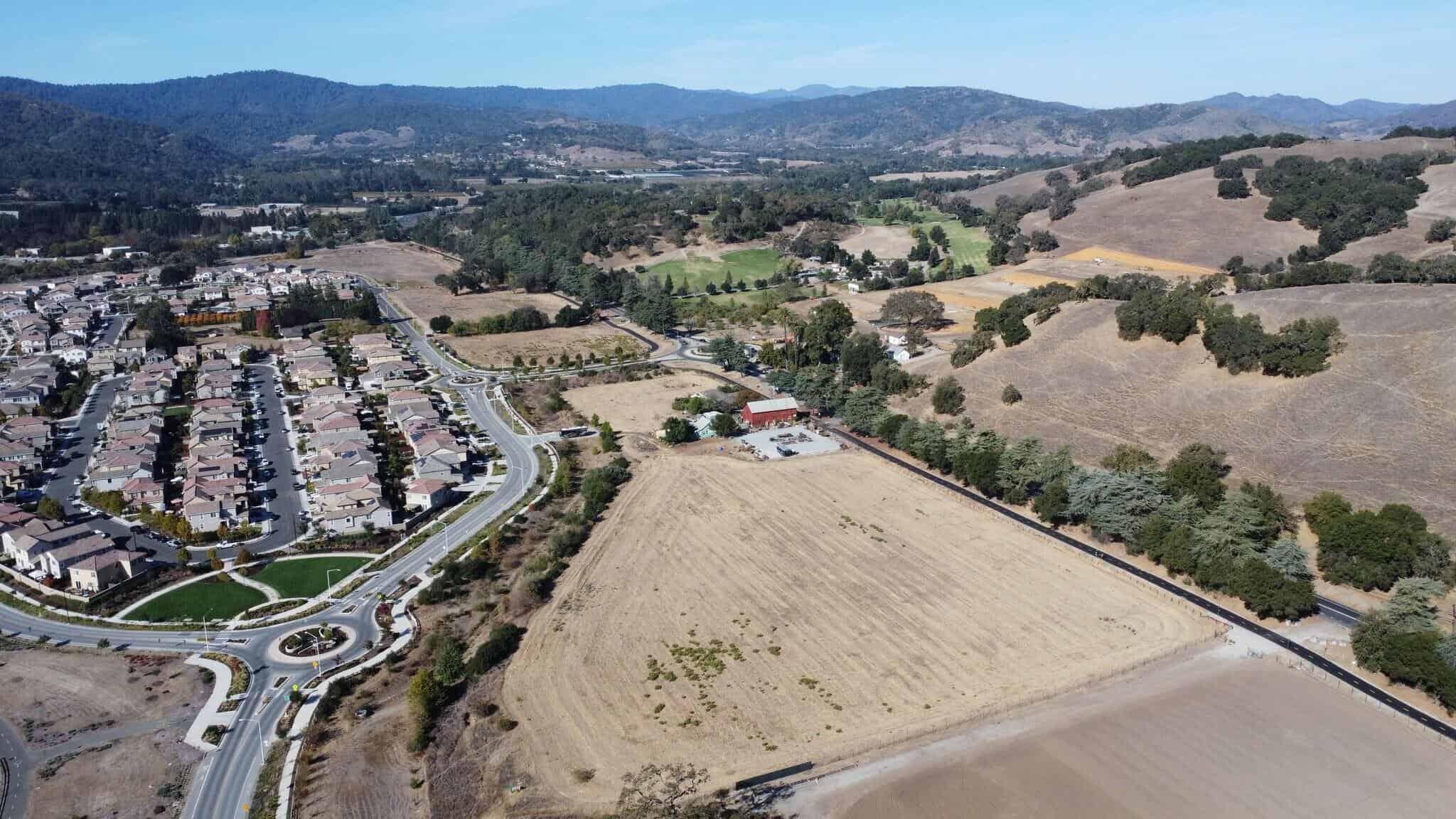 Aerial view of land and residential neighborhoods in Los Gatos, CA.