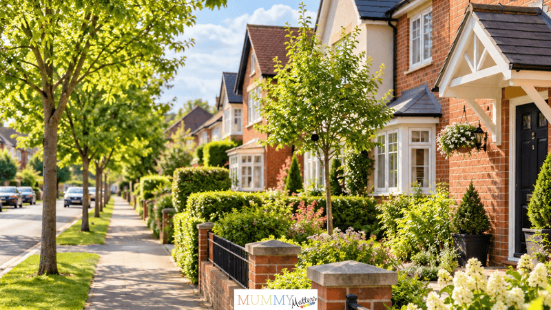 A quiet, tree-lined residential street with attractive family homes and well-kept gardens