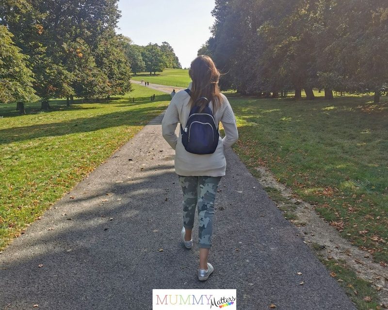Woman walking along a countryside path