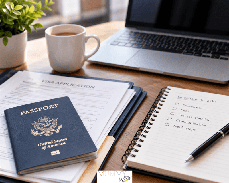 US passport, visa application paperwork and a notebook listing questions to ask an immigration attorney during a consultation