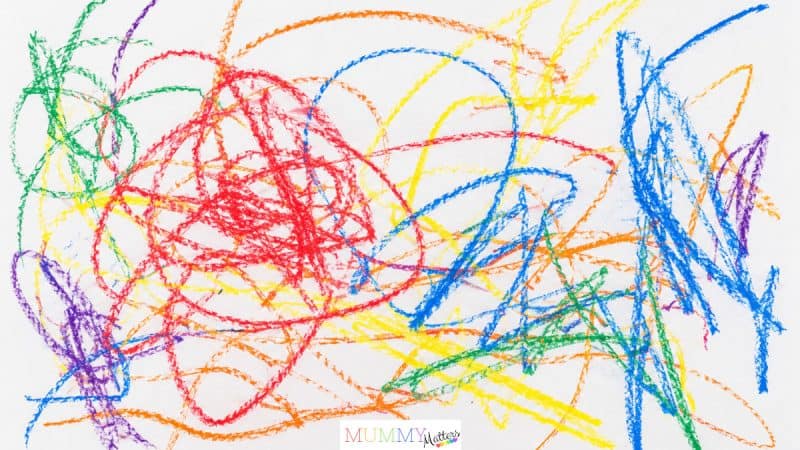 Illustrative example of the scribble stage showing colourful crayon loops, lines and overlapping marks
