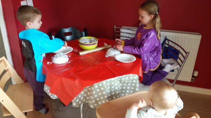 a group of kids sitting at a table