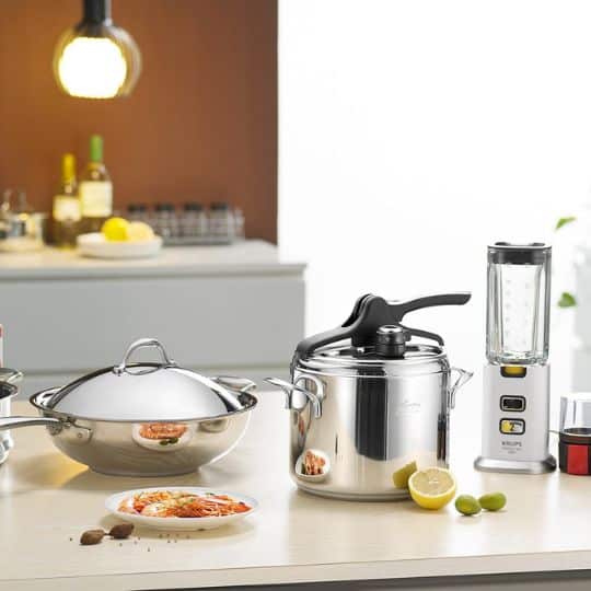 a kitchen counter with a pot and a blender