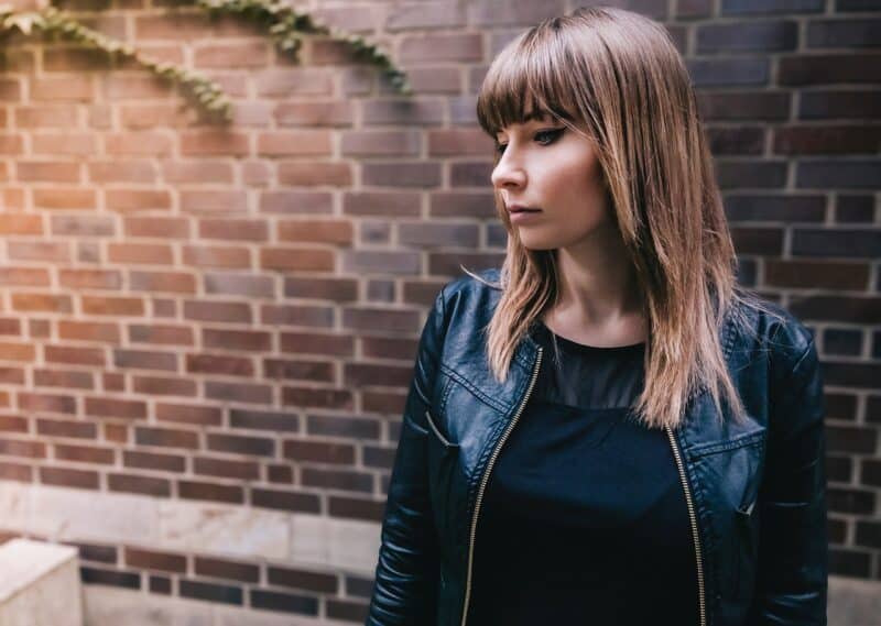 a woman in a black jacket