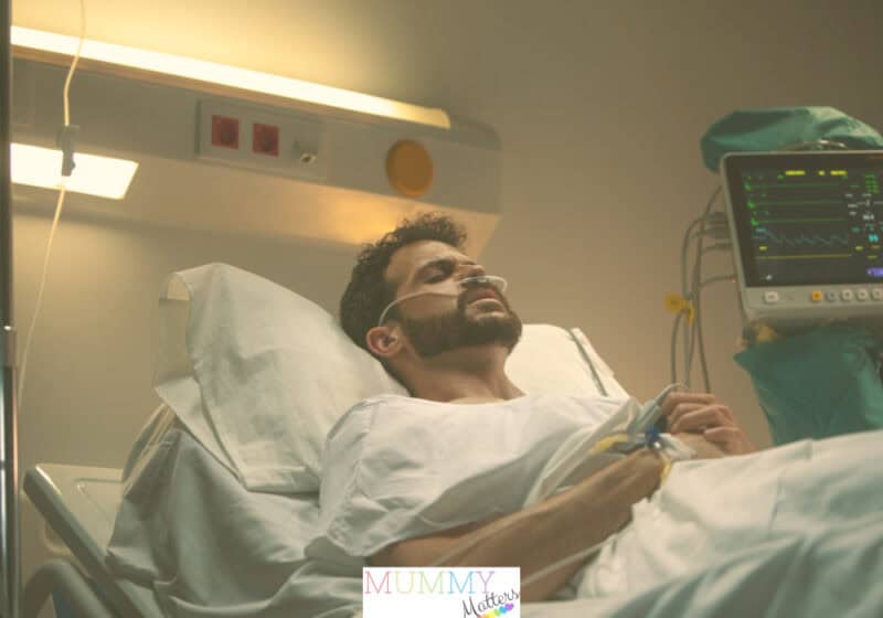 A patient resting in a hospital bed, symbolizing the importance of knowledge management in enhancing patient outcomes