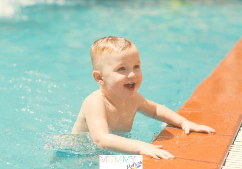 Happy toddler in swimming pool