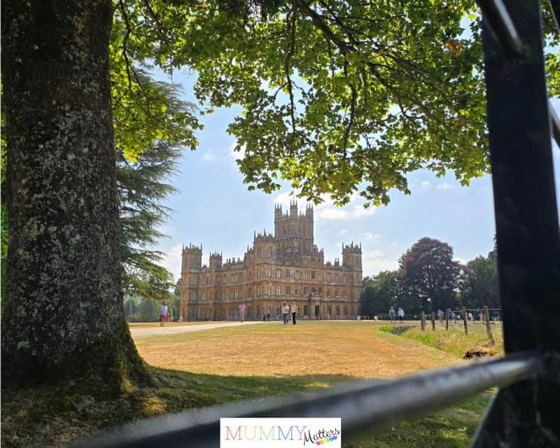 Highclere Castle viewed from the driveway on a sunny summer afternoon.