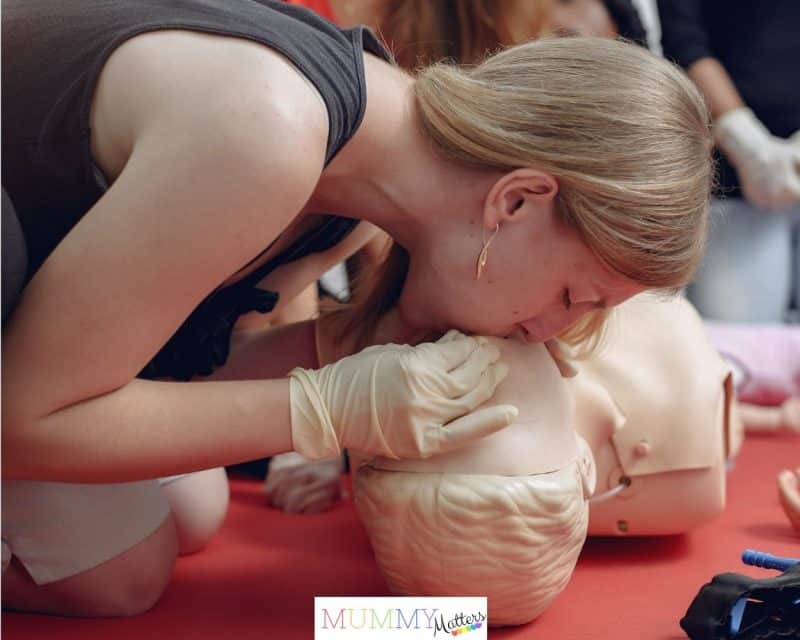 Teen learning basic first aid