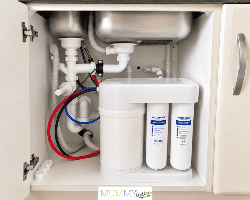Aquaphor RO-101S installed under our kitchen sink alongside the existing pipework