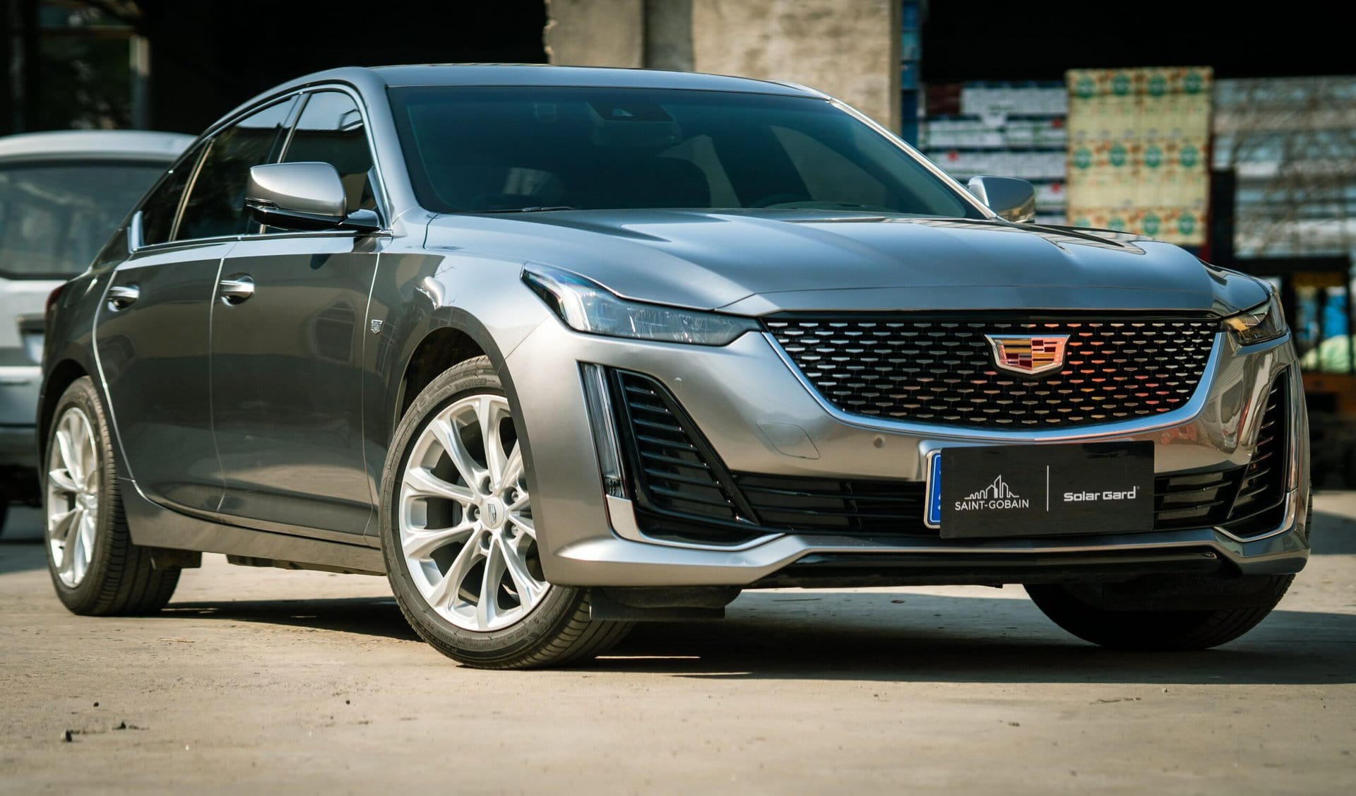 Cadillac sedan undergoing maintenance at Del Mar Car Care, showcasing expert auto service for luxury vehicles.