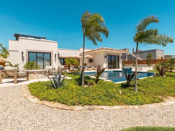 Diamante Beach Estates Home With Gardens And Palm Trees