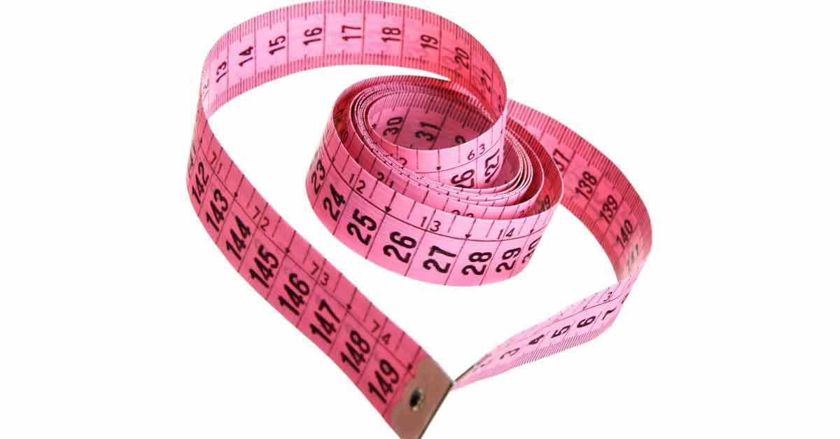 A pink measuring tape shaped like a heart on white, evoking Disney Princess dreams and royal fun at the parks.