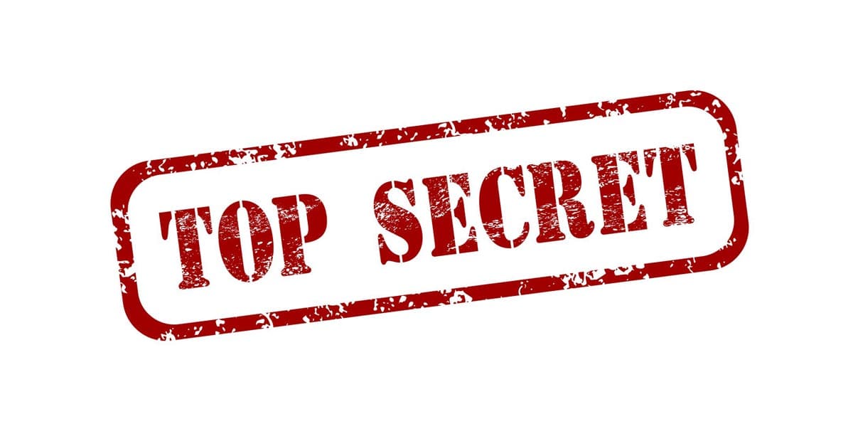 Red, distressed "TOP SECRET" stamp on white—hinting at hidden Disneyland princess audition secrets for Disney fans.