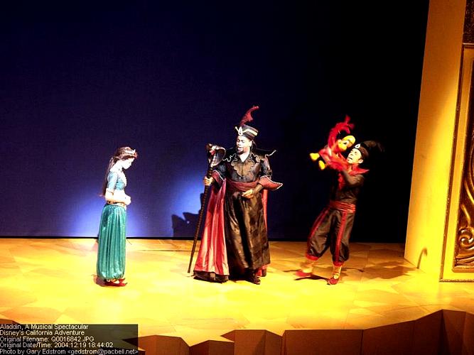 Jasmine, Jafar, and Iago with his red puppet light up the stage in Disney’s Aladdin—bringing the animated classic to life.