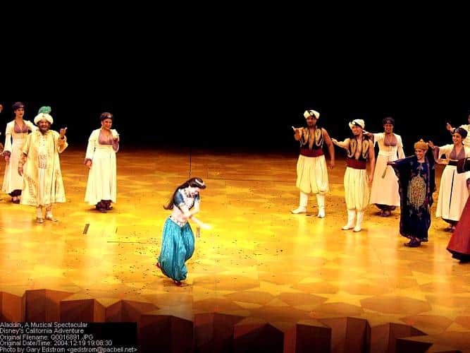 Princess Jasmine takes a bow on stage as the Aladdin musical cast applauds, thrilling Disney Parks guests with Broadway magic.