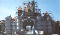 Sleeping Beauty Castle at Disneyland covered in scaffolding during construction—a rare behind-the-scenes look for Disney fans.