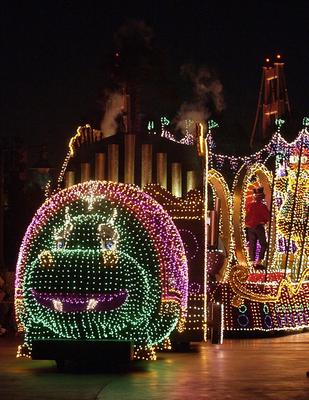 The sparkling hippo float glides through Main Street, lighting up the Disneyland Electrical Parade with vibrant colors and magic.