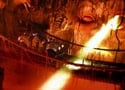Guides in themed uniforms lead guests past a dramatic blast furnace, where glowing molten metal flows on the steel factory tour.