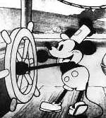 Mickey Mouse captains a ship’s wheel in a classic black-and-white scene, capturing the magic of his 1928 debut at Disney parks.